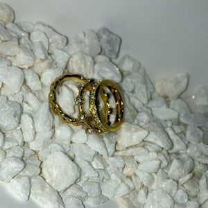three different styles of gold rings